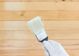 Hand in glove cotton holding brush paints