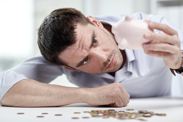 Sticker - businessman with piggy bank and coins at office