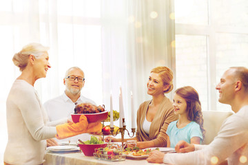 smiling family having holiday dinner at home