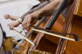 Fototapeta  -  Musician hand playing the double bass in the orchestra closeup