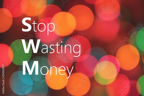 Fotografie, Obraz Stop Wasting Money text on colorful bokeh background