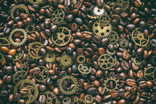 Mock Up For Background In Steampunk Style. Roasted Coffee Beans Mixed With Brass Gears. Grunge Style Toned. Top View.