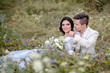 © ronedya - Young couple in love outdoor. Elegant bride and groom posing together outdoors on a wedding day. bride and groom in the Park. young couple in the woods. young couple in the grass. couple walking