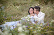 © ronedya - Young couple in love outdoor. Elegant bride and groom posing together outdoors on a wedding day. bride and groom in the Park. young couple in the woods. young couple in the grass. couple walking