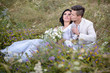 © ronedya - Young couple in love outdoor. Elegant bride and groom posing together outdoors on a wedding day. bride and groom in the Park. young couple in the woods. young couple in the grass. couple walking