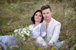 © ronedya - Young couple in love outdoor. Elegant bride and groom posing together outdoors on a wedding day. bride and groom in the Park. young couple in the woods. young couple in the grass. couple walking