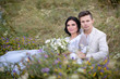 © ronedya - Young couple in love outdoor. Elegant bride and groom posing together outdoors on a wedding day. bride and groom in the Park. young couple in the woods. young couple in the grass. couple walking