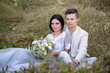 © ronedya - Young couple in love outdoor. Elegant bride and groom posing together outdoors on a wedding day. bride and groom in the Park. young couple in the woods. young couple in the grass. couple walking