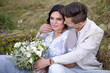 © ronedya - Young couple in love outdoor. Elegant bride and groom posing together outdoors on a wedding day. bride and groom in the Park. young couple in the woods. young couple in the grass. couple walking