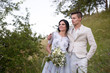 © ronedya - Young couple in love outdoor. Elegant bride and groom posing together outdoors on a wedding day. bride and groom in the Park. young couple in the woods. young couple in the grass. couple walking