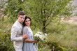 © ronedya - Young couple in love outdoor. Elegant bride and groom posing together outdoors on a wedding day. bride and groom in the Park. young couple in the woods. young couple in the grass. couple walking