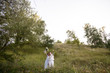 © ronedya - Young couple in love outdoor. Elegant bride and groom posing together outdoors on a wedding day. bride and groom in the Park. young couple in the woods. young couple in the grass. couple walking