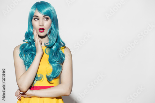 Fotografie, Obraz Pop art woman portrait wearing blue curly wig and bright yellow