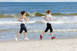 © Jacek Chabraszewski - Two women running on beach