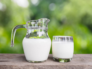 Fresh organic milk on wooden table