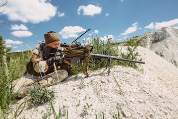 Army sniper during the military operation in the mountain. 