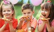 © Africa Studio - Children eating pizza in park