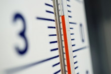 Macro Detail Of And Old Dusty Outdoor Thermometer In The Retro Design Measuring Very High Temperature Of Thirty Five Degrees Of Celsius As A Symbol Of Summer And Heat 