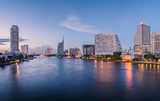Fototapeta  - Bangkok city with business building and water traffic at chao pr