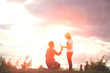 silhouette romantic couple in love and happy time sunset (Soft f