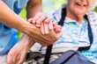 Leinwandbild Motiv Nurse consoling senior woman holding her hand
