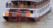 Close Up View Of A Paddle Wheel Boat On The River Thames In London