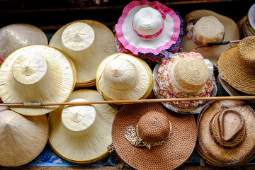 Wall Mural - Hat-weaving, handmade goods, and is one of the souvenirs sold in the Damnoen Saduak floating market. Ratchaburi