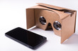 © misszin - cardboard virtual reality headset and a smartphone