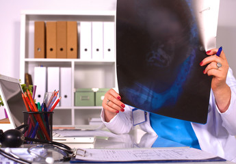 Wall Mural - Young doctor at the table is receiving patient