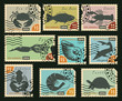 set of postage stamps with silhouettes of sea animals