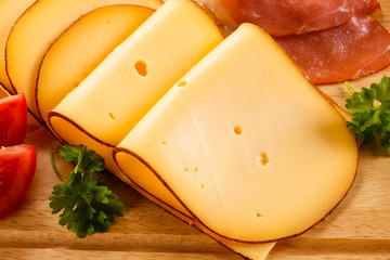 Wall Mural - Cheese on cutting board on white background 