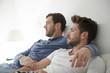 © Picxel Creative - Gay Male Couple At Home Relaxing In Bed Together