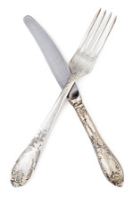 Old Silver Knife And Fork Crossed Isolated