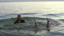 Caucasian Man Emerges From The Sea Slowmotion. European Girl Emerges From Under The Feet Of Water Slow Motion. 20s Couple People Fleeing Into The Ocean Slo-mo. Guy And Woman Drowned Slow-mo.