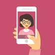 © anitnov - Vector illustration of a glasses woman take a selfie picture of her self with smart phone in pink background.