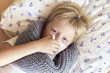 © mizina - Sick boy blowing nose