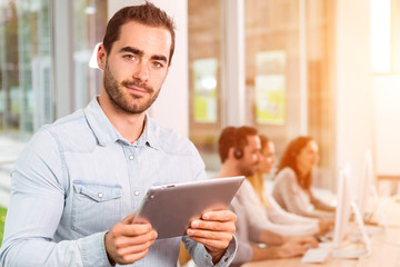 Portrait of a young attractive man at work