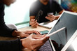 © everythingpossible - two colleague web designer discussing data and digital tablet do