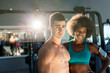 © Myvisuals - Athletic man and  afro american woman posing in gym. Couple that trains together stays together