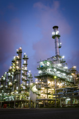 petrochemical plant column tower at twilight