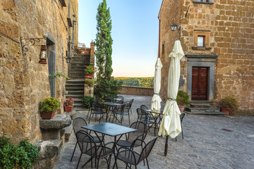 Wall Mural - Deserted streets and restaurant in the ancient town of Italy.