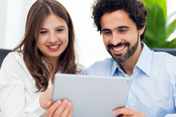 Wall Mural - Couple working in their office