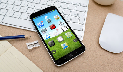 Modern mobile phone on a desk 3D rendering