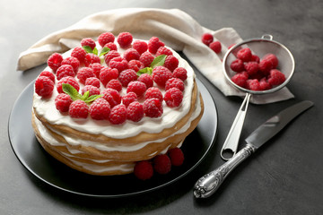 Wall Mural - Tasty raspberry cake on grey background