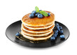 Tasty pancakes with blueberries on plate, isolated on white