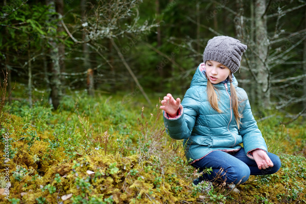Cute funny little girl having fun during hike in a woods Stock Photo ...