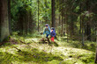 © MNStudio - Two funny little sisters having fun during forest hike