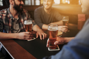 Wall Mural - happy male friends drinking beer at bar or pub