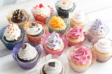 Many Different Colored Delicious Cupcakes