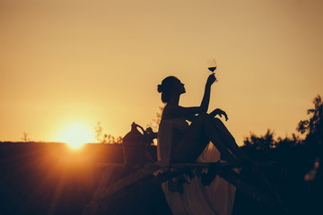 Canvas Print - Silhouette of girl with wine